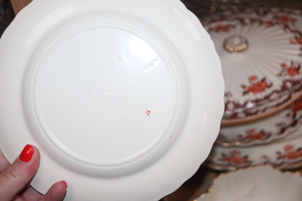 A Victorian Copeland part dinner service, transfer-printed with peonies and foliage in orange and brown,